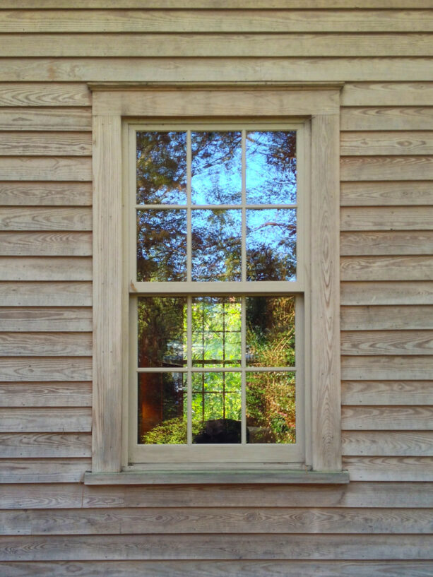a pine rustic window trim brings all the natural looks a mountain-style exterior needs