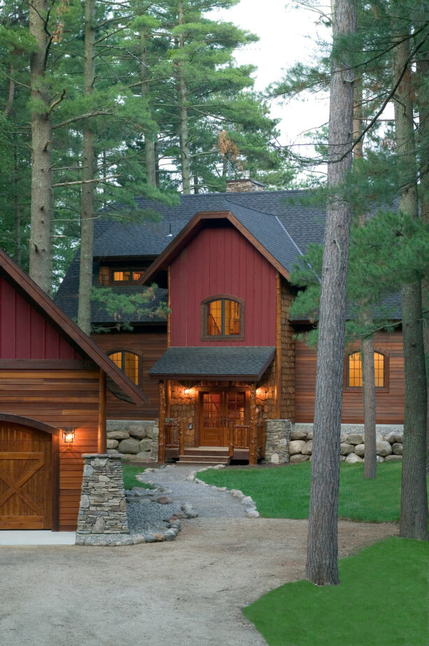 a red siding and a dark brown rustic window trim make a really nice pair