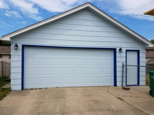 a simple blue door trim for a timeless garage