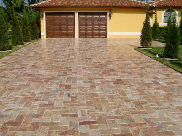 an idea that suits a clean driveway should involve a travertine paver with camouflaged edging