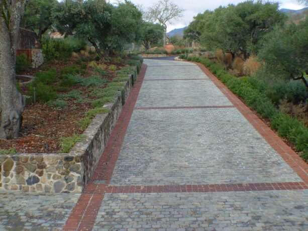 cobblestone paving and brick edging makes a historic paver
