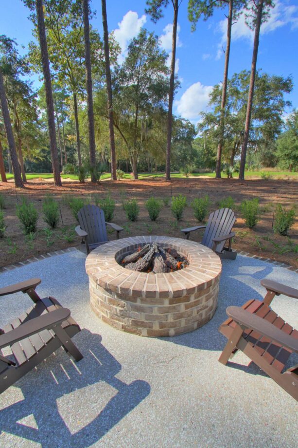 old savannah gray bricks and mortar make a sleek base for a crushed stone patio