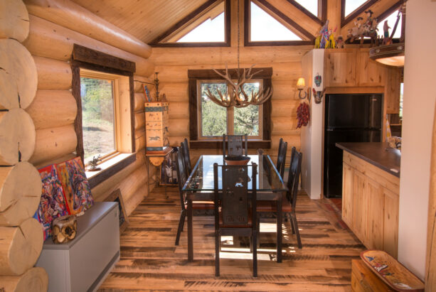 rustic mushroom wood window trims surrounded by logs