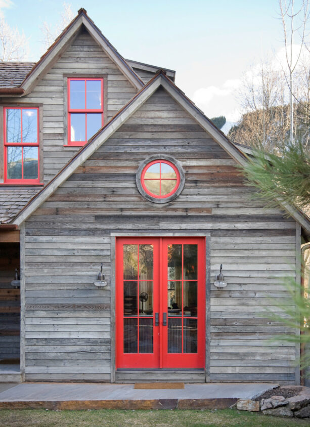 rustic reclaimed lumber window trims add a nice weathered look to an exterior