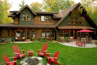 wooden rustic window trims are fitting additions to green sidings