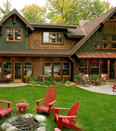 wooden rustic window trims are fitting additions to green sidings