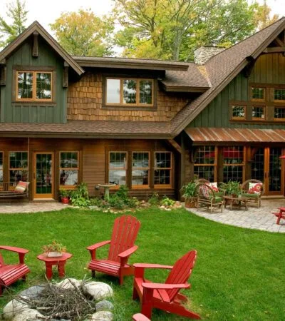 wooden rustic window trims are fitting additions to green sidings