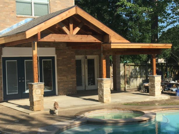 a cedar patio cover adds a nice weathered look to the main home