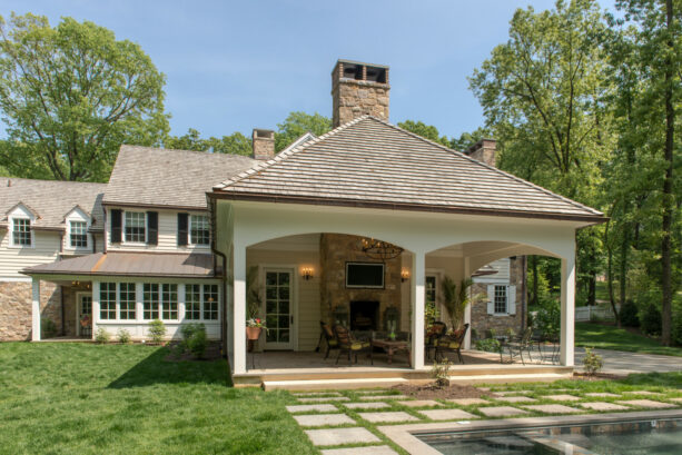 a cedar shake roof covering a traditional patio