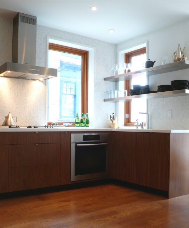 a pair of short stainless-steel shelves for a small kitchen window