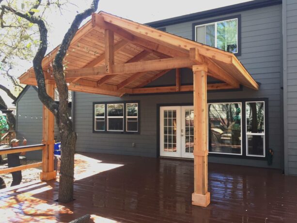 a solid tongue and groove cedar patio cover brightens a craftsman's exterior