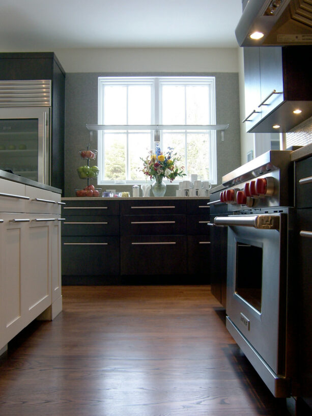 a stainless fixed bracket window shelf is a fitting addition to a farmhouse kitchen