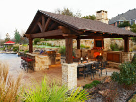 medium brown stained cedar patio cover looks classy, hovering over a traditional outdoor space