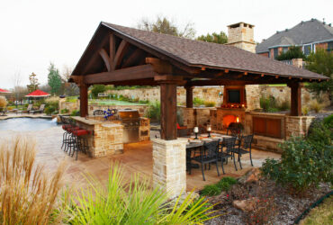 medium brown stained cedar patio cover looks classy, hovering over a traditional outdoor space