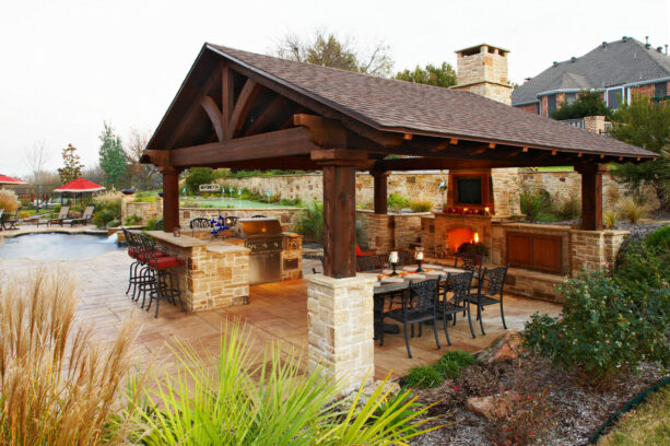 medium brown stained cedar patio cover looks classy, hovering over a traditional outdoor space